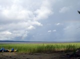 Озеро Вагатозеро штормит, радуга и на противоположном берегу деревня Нижняя Салма